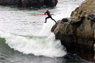 Surfer off Lighthouse Point