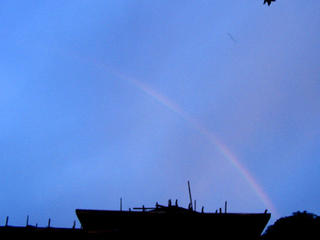a rainbow at sundown