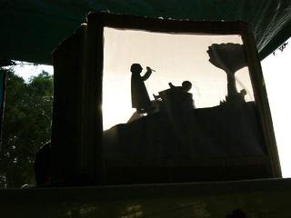 shadow puppet show at sunset